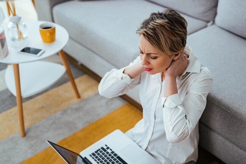 exhausted-businesswoman-having-neckache-while-working-laptop-home_637285-4665-Nov-01-2024-07-32-04-1522-PM